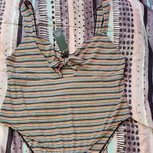 Brand new, never worn striped bodysuit.